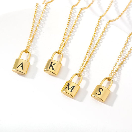 Four Initial Lock Necklaces with initials A, K, M, S, respectively.