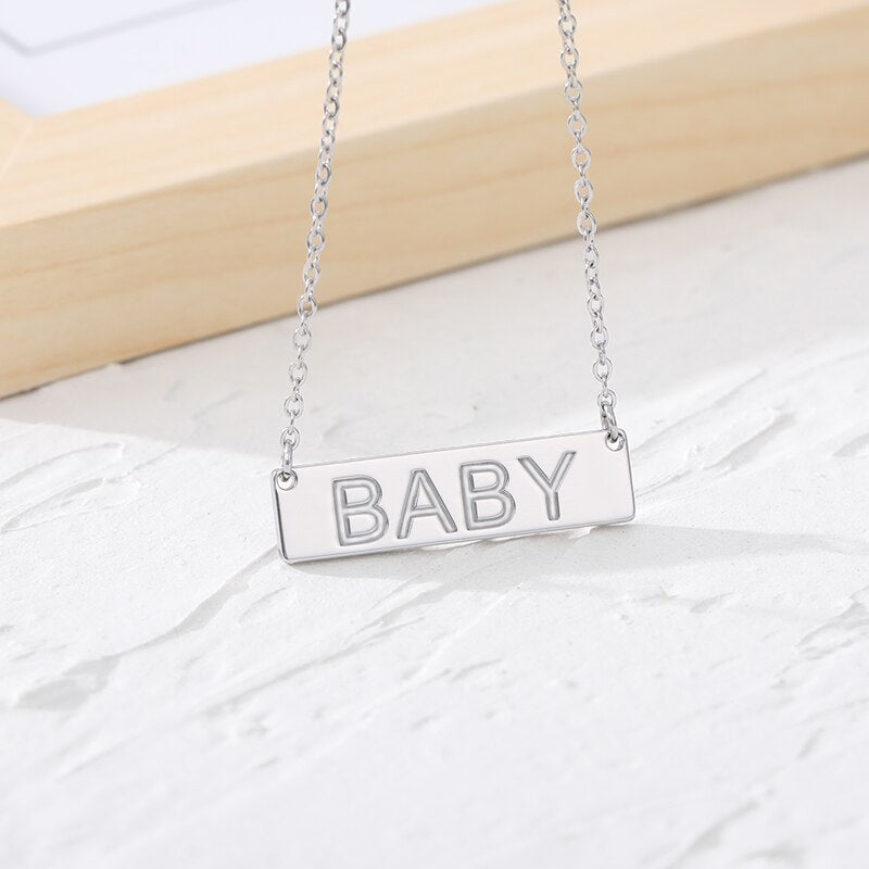 Name Bar Necklace in silver color and word "BABY" stamped