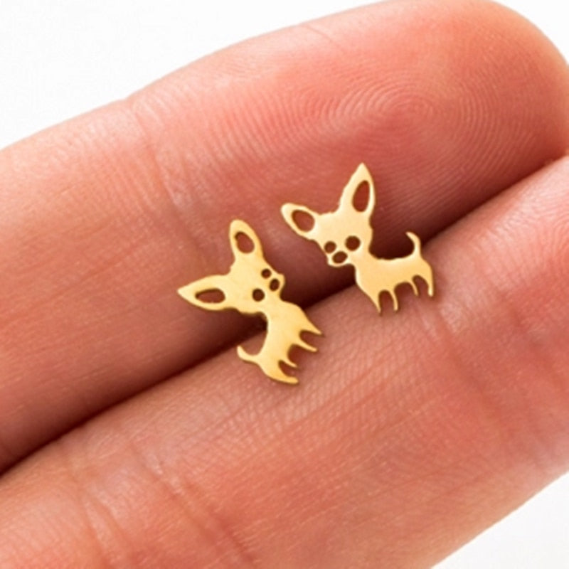 Chihuahua Stud Earrings in Gold color on a palm